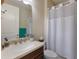 Well-lit bathroom featuring a single sink vanity, modern fixtures, and a shower-tub combination at 2397 Vaccaro Dr, Sarasota, FL 34231