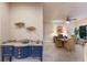 Charming entryway with a unique console table, leading into a bright dining area with a ceiling fan and natural light at 2397 Vaccaro Dr, Sarasota, FL 34231