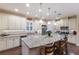 Spacious kitchen with granite countertops, stainless steel appliances, a large island, and pendant lighting at 2397 Vaccaro Dr, Sarasota, FL 34231