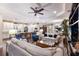 Open-concept living area featuring hardwood floors, a kitchen island with seating, and a comfortable seating area at 2397 Vaccaro Dr, Sarasota, FL 34231