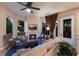 Cozy living room with a fireplace, comfortable seating, and scenic outdoor views at 2397 Vaccaro Dr, Sarasota, FL 34231