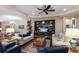 Elegant living room with stylish furnishings, hardwood floors, and a decorative entertainment center at 2397 Vaccaro Dr, Sarasota, FL 34231