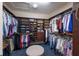 Large walk-in closet with custom shelving and ample storage space for clothes, shoes, and accessories at 2397 Vaccaro Dr, Sarasota, FL 34231