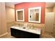 Bathroom with a double sink vanity and a neutral tile backsplash at 2763 Woodgate Ln # 108, Sarasota, FL 34231