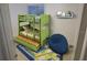 This bedroom features a stylish green bunk bed, a beanbag chair and decorative surfboard rug at 2763 Woodgate Ln # 108, Sarasota, FL 34231