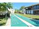 Well-maintained shuffleboard courts situated near residential buildings at 2763 Woodgate Ln # 108, Sarasota, FL 34231