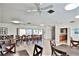 Large community room with ample seating and a kitchenette area at 2763 Woodgate Ln # 108, Sarasota, FL 34231