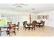 Bright community room with multiple seating arrangements and natural light at 2763 Woodgate Ln # 108, Sarasota, FL 34231