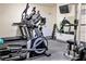 Well-equipped exercise room featuring treadmills, weight machines and free weights at 2763 Woodgate Ln # 108, Sarasota, FL 34231