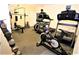 Well-equipped exercise room featuring treadmills, weight machines and free weights at 2763 Woodgate Ln # 108, Sarasota, FL 34231