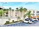 Relaxing condo community featuring a pool, palm trees and convenient parking at 2763 Woodgate Ln # 108, Sarasota, FL 34231