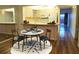 Cozy eat-in kitchen featuring modern appliances and a breakfast bar at 2763 Woodgate Ln # 108, Sarasota, FL 34231