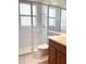 Clean bathroom with a glass-enclosed shower, white tiles, and a modern vanity at 2980 Seasons Blvd, Sarasota, FL 34240