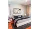 Comfortable bedroom with stylish bedding, elegant nightstands, and chic decor at 2980 Seasons Blvd, Sarasota, FL 34240