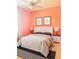 Vibrant bedroom featuring bright walls, a plush bed, and stylish bedside lamps at 2980 Seasons Blvd, Sarasota, FL 34240