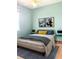 Serene bedroom featuring calming blue walls, a cozy bed, and stylish side tables at 2980 Seasons Blvd, Sarasota, FL 34240