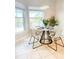 Cozy dining area with large windows and a modern round table set at 2980 Seasons Blvd, Sarasota, FL 34240
