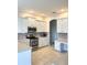 Well-lit kitchen featuring white cabinets, stainless steel appliances, and stylish backsplash at 2980 Seasons Blvd, Sarasota, FL 34240