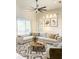 Bright living room featuring neutral tones, a high ceiling, large windows, and contemporary decor at 2980 Seasons Blvd, Sarasota, FL 34240