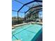Sparkling screened-in pool with a hot tub offering a refreshing oasis with water views at 2980 Seasons Blvd, Sarasota, FL 34240