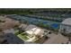 Aerial view of home with lush landscaping and proximity to IMG Academy tennis facilities at 3609 57Th Avenue W Dr # 37, Bradenton, FL 34210