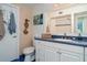 Bathroom with blue countertops, coastal artwork, and a shower/tub combo at 3609 57Th Avenue W Dr # 37, Bradenton, FL 34210