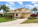 Charming home featuring lush landscaping, a well-manicured lawn, and an attached garage at 3609 57Th Avenue W Dr # 37, Bradenton, FL 34210
