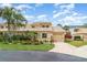 Charming home with a manicured lawn, mature trees, and an attached garage at 3609 57Th Avenue W Dr # 37, Bradenton, FL 34210