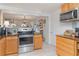 Updated kitchen featuring stainless steel appliances, wood cabinetry, and modern finishes at 3609 57Th Avenue W Dr # 37, Bradenton, FL 34210