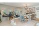 Bright open-plan living room with high ceilings and adjoining dining area at 3609 57Th Avenue W Dr # 37, Bradenton, FL 34210