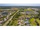 Aerial view highlights the desirable community, showcasing its prime location and scenic pond views at 3816 Little Country Rd, Parrish, FL 34219