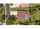 Aerial view of home featuring well-manicured landscaping, driveway, and screened pool at 3816 Little Country Rd, Parrish, FL 34219