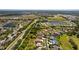 Panoramic aerial of a neighborhood featuring picturesque ponds and beautifully landscaped surroundings at 3816 Little Country Rd, Parrish, FL 34219