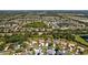 Expansive aerial view of a community with mature trees, several ponds, and well-maintained landscaping at 3816 Little Country Rd, Parrish, FL 34219
