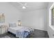 Stylish bedroom with a modern aesthetic, featuring a unique marble floor and trendy decor at 3816 Little Country Rd, Parrish, FL 34219