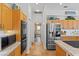 Well-equipped kitchen showing stainless steel appliances and ample counter space at 3816 Little Country Rd, Parrish, FL 34219