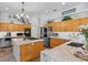 Bright open kitchen with granite countertops, stainless steel appliances, and ample storage at 3816 Little Country Rd, Parrish, FL 34219