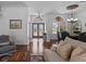 Inviting living space featuring hardwood floors, transom windows and lots of natural light at 3816 Little Country Rd, Parrish, FL 34219