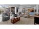 Open living room flowing into the kitchen with comfortable seating and natural light at 3816 Little Country Rd, Parrish, FL 34219
