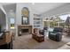 Spacious living room with fireplace, built-ins, and access to the outdoor living space at 3816 Little Country Rd, Parrish, FL 34219