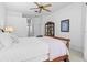 Bright main bedroom features a ceiling fan, neutral decor, and soft natural light at 3816 Little Country Rd, Parrish, FL 34219