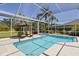 Screened-in pool area with lounge chairs and green landscape, perfect for private relaxation at 3816 Little Country Rd, Parrish, FL 34219