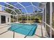 Sparkling pool and spa in screened enclosure, perfect for outdoor relaxation and entertainment at 3816 Little Country Rd, Parrish, FL 34219