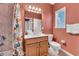 Bathroom features vanity with storage, toilet, and shower with tub combo at 426 Magnolia Ave, Anna Maria, FL 34216