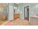 Bathroom featuring a vanity, walk-in shower, and neutral tile flooring creating a functional and stylish space at 426 Magnolia Ave, Anna Maria, FL 34216