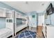 Shared bedroom with white bunkbeds, providing a fun and functional space at 426 Magnolia Ave, Anna Maria, FL 34216