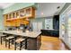 Spacious kitchen featuring a large island with seating, stainless steel appliances, and ample cabinet space at 426 Magnolia Ave, Anna Maria, FL 34216