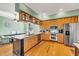 Well-equipped kitchen with stainless steel appliances and granite countertops open to the dining area at 426 Magnolia Ave, Anna Maria, FL 34216