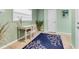 Cozy home office featuring a desk, chair, rug and natural light from the window at 426 Magnolia Ave, Anna Maria, FL 34216