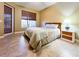 Comfortable bedroom featuring tile floors, a neutral color scheme, and outdoor views at 4721 Turnberry Cir, North Port, FL 34288